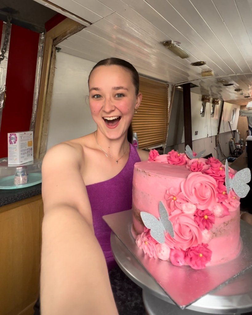 Chloe Woodroffe with a pink cake